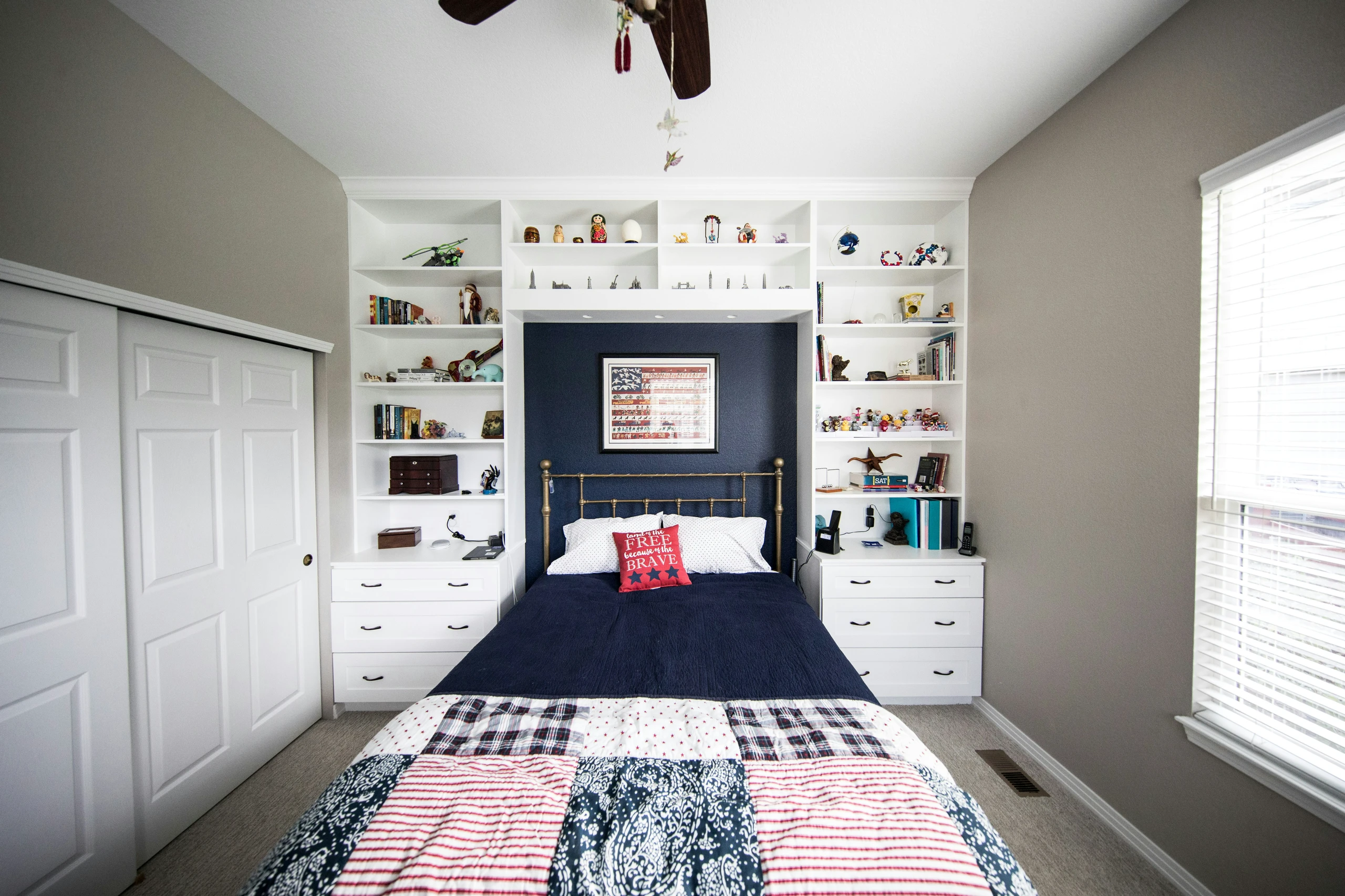 Bright and organized bedroom featuring built-in shelves and cabinets that cleverly use the space above the headboard, showcasing practical small bedroom ideas with storage that maximize vertical space.