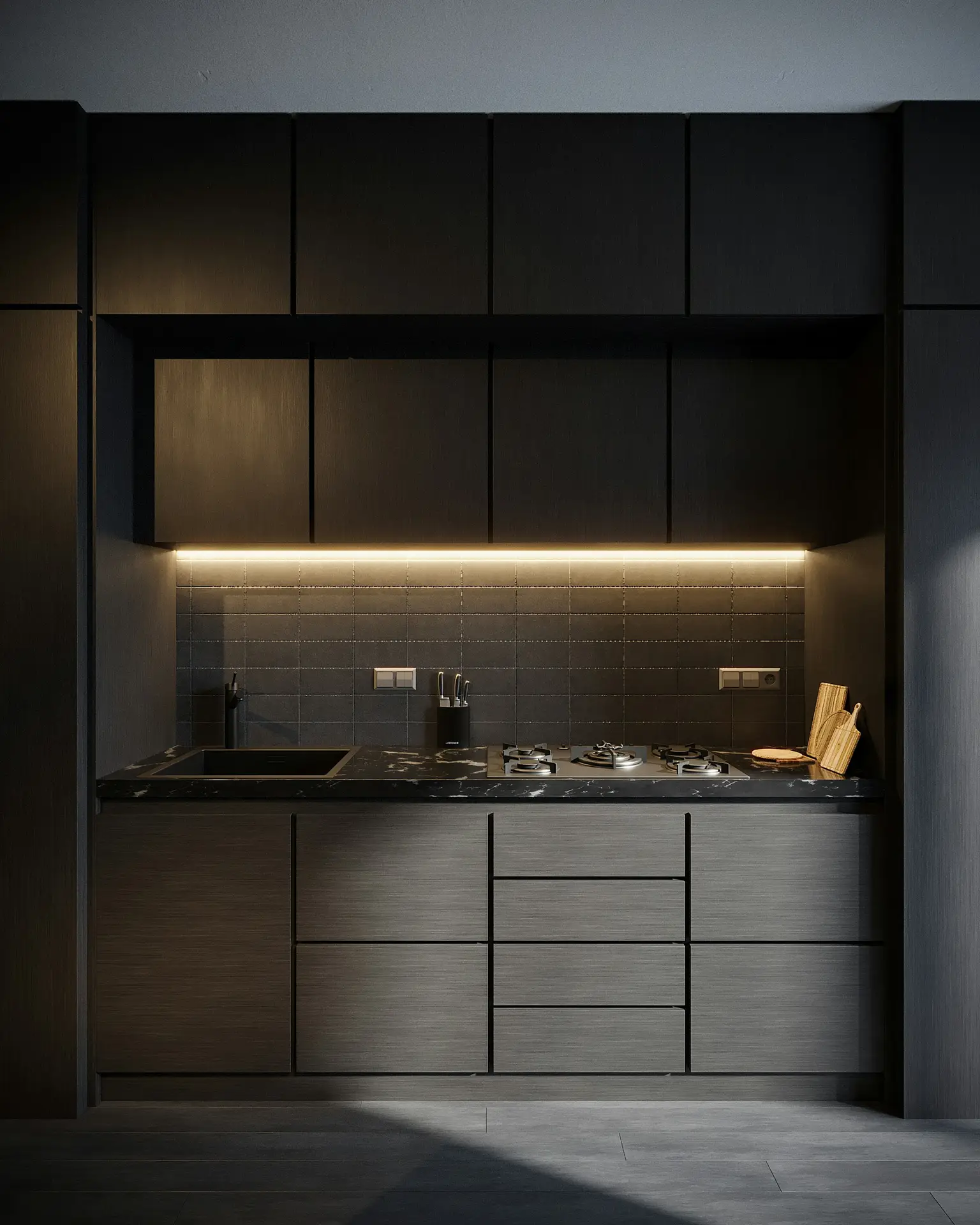 Modern dark-toned kitchen with sleek cabinetry and a black marble countertop, illuminated by warm under cabinet lights. The glow emphasizes the textured backsplash and adds depth to the overall design, making it a standout example of kitchen lighting ideas for creating a stylish yet functional cooking space.