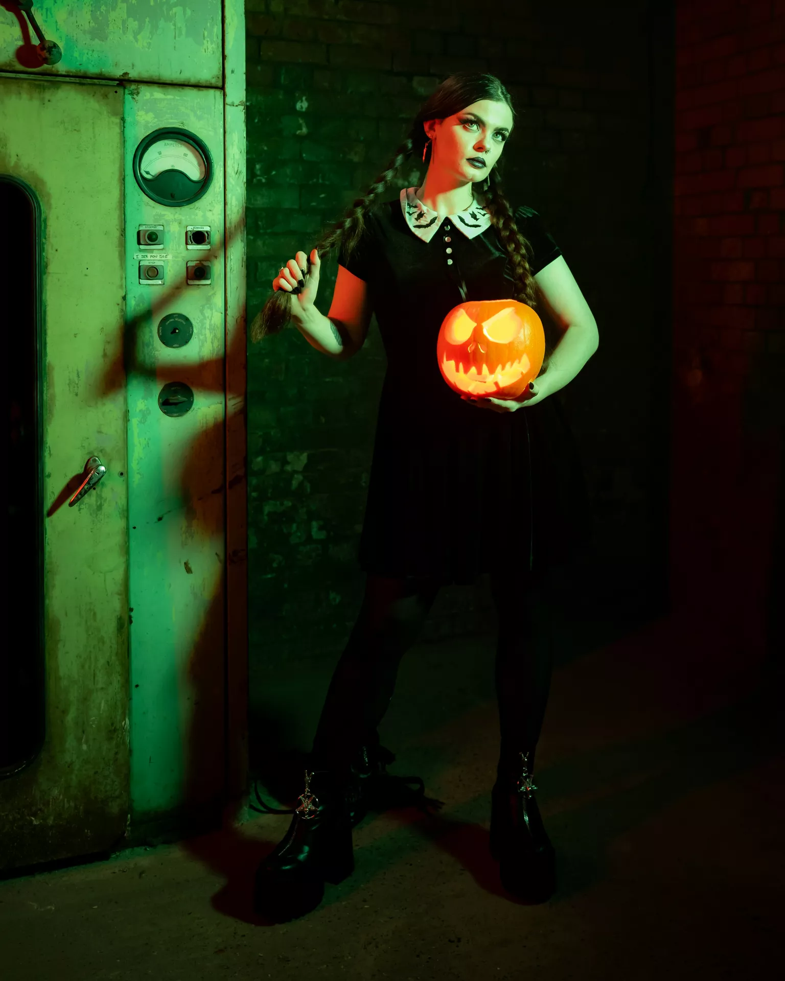 Halloween costume ideas featuring a Wednesday-inspired look with braided hair, a black dress with a white collar, dark makeup, and a glowing jack-o-lantern.