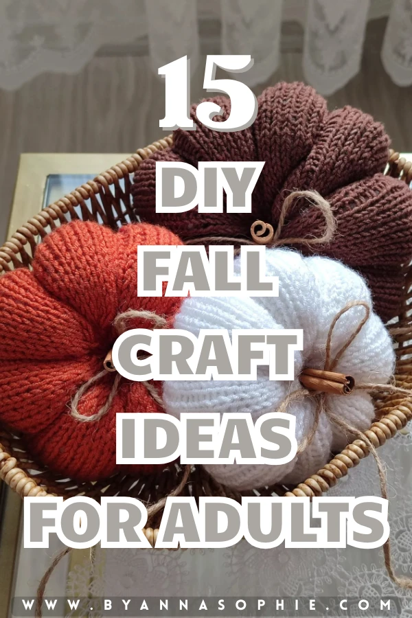 Pinterest pin featuring three cozy crocheted pumpkins in rust orange, white, and deep brown displayed in a woven basket, with bold text reading 15 DIY Fall Craft Ideas for Adults.
